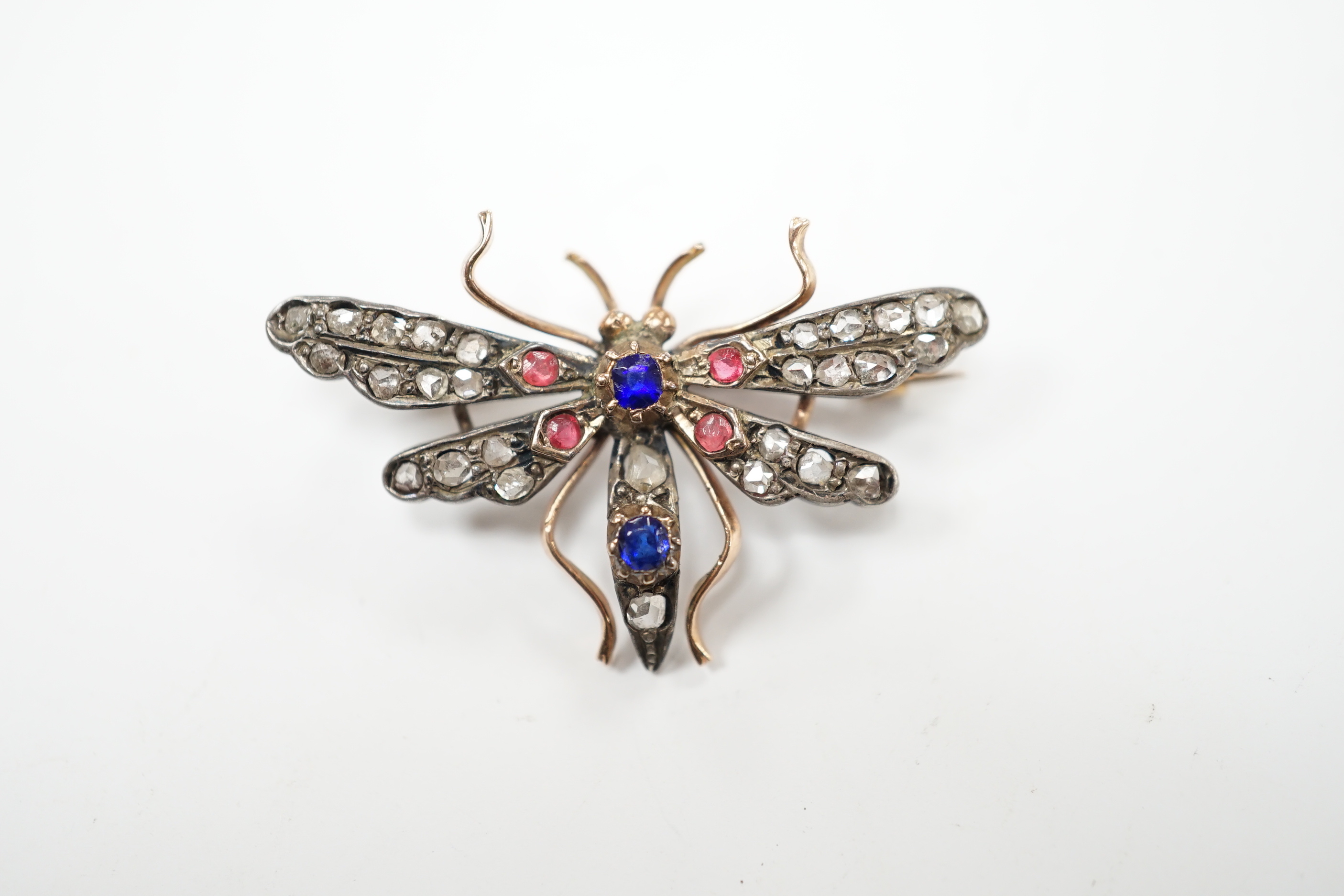 A Victorian yellow and white metal, rose cut diamond and two colour paste? set bug brooch, width 35mm, gross weight 4 grams.